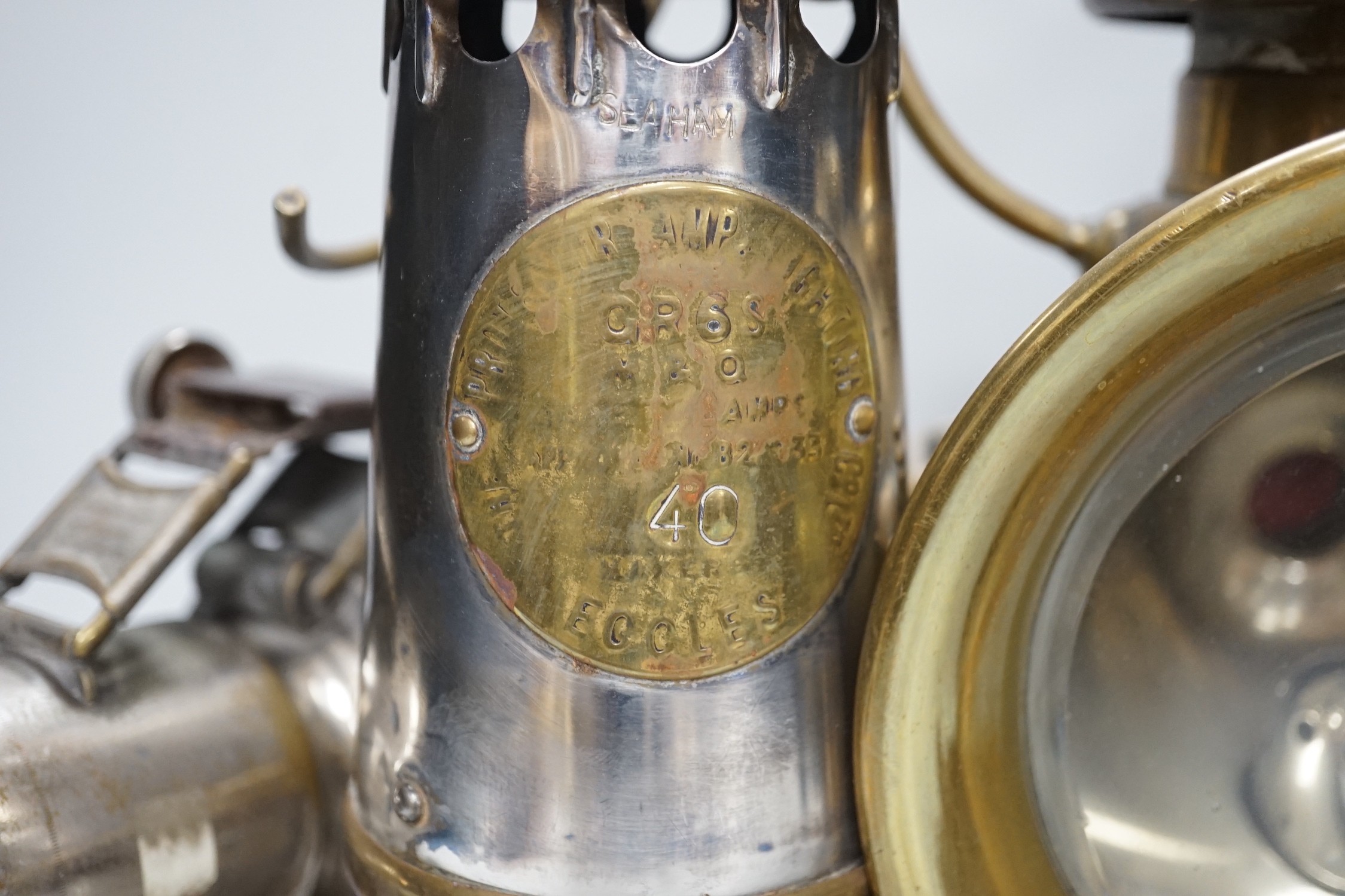 A miner's lamp stamped Seaham, and two Lucas road lamps and a H & B side lamp, No. 1001, largest 30cms high